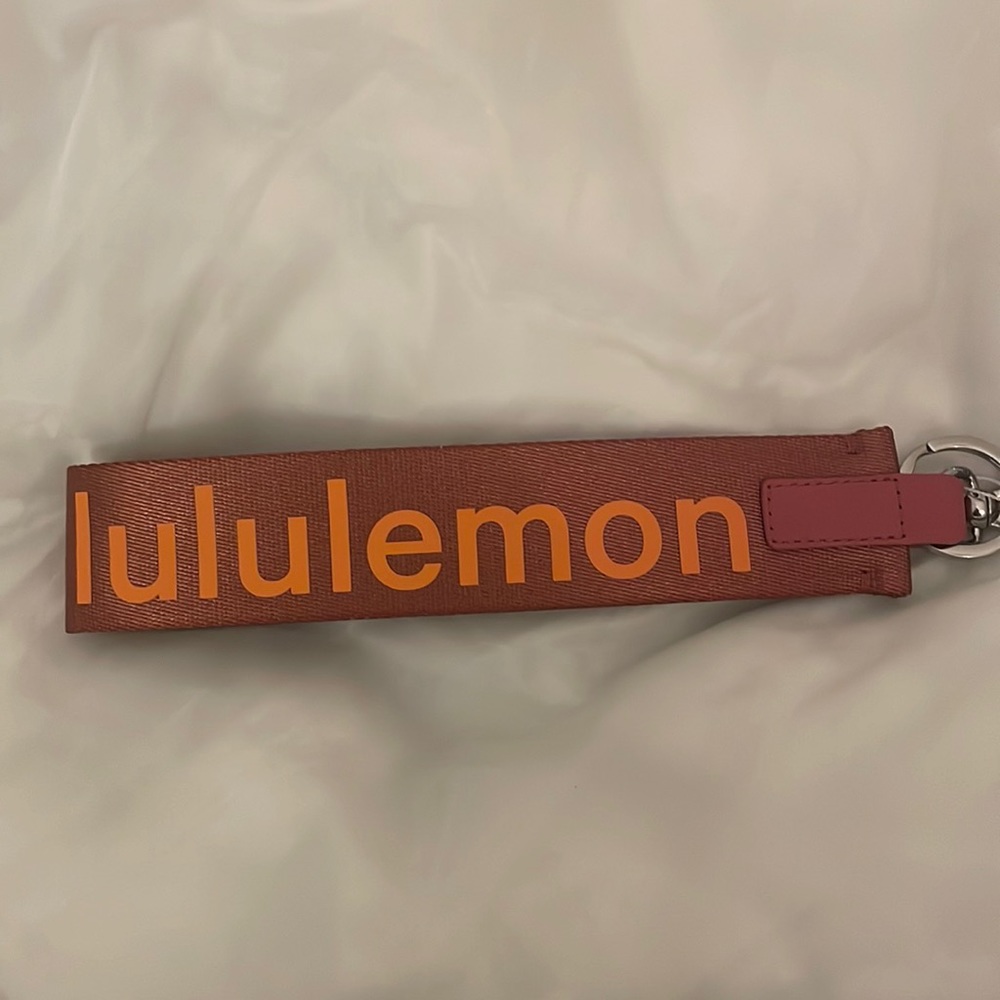 NWT Never Lost Keychain (Brier Rose/Orange
Frappe) Lululemon